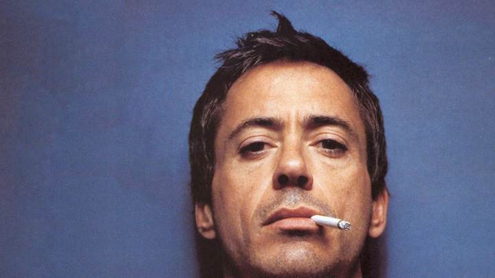Robert Downey Jr. Doing Smoking Face Closeup N Blue Background
